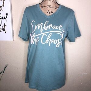 Cheekys Blueish Color T shirt with “Embrace the Chaos” in Pink Size S